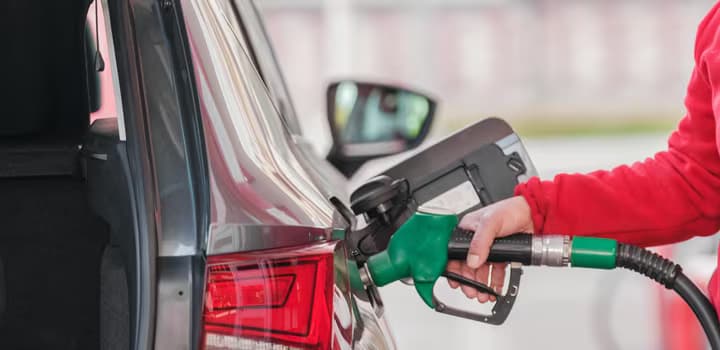 Close-up of a Person Refueling the Car at a Gas Station