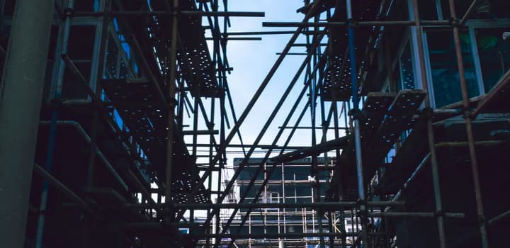 Scaffolding between buildings in city