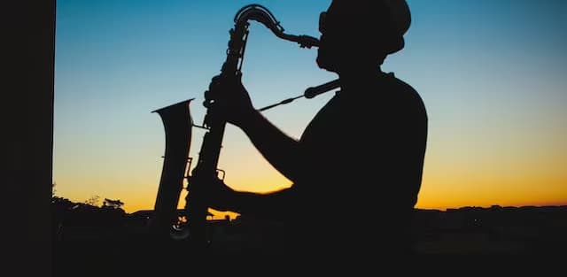 Silhouette of a Man Playing Saxophone during Sunset